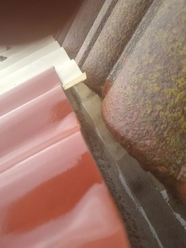 Close-up of a clean, clear gutter corner after cleaning
